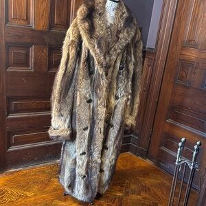 Vintage full length double-breasted raccoon fur coat with shawl collar.